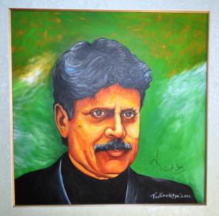 The Cricket Legend, Kapil Dev signs on the portrait created by Tulirekha Deb after unveiling it. at Royal Global School, Guwahati.